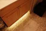 Suitable for the Home as well - Warm White used as low-wattage bathroom lighting underneath a sink